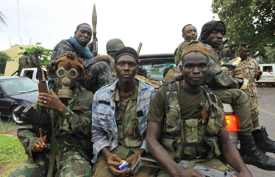 Fighters loyal to Ivory Coast President-elect Alassane Ouattara prepared for an assault in the city of Abidjan on Tuesday.