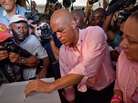 Then-candidate Michel Martelly casts his ballot at a polling station during a presidential runoff in Port-au-Prince, on March 20. Then-candidate Michel Martelly casts his ballot at a polling station during a presidential runoff in Port-au-Prince, on March 20.