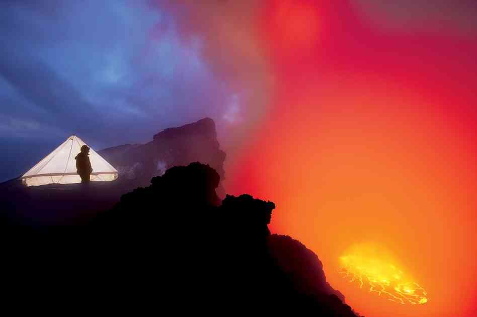 "The Nyiragongo expedition's cooking tent glows in the twilight on the rim of the volcano."