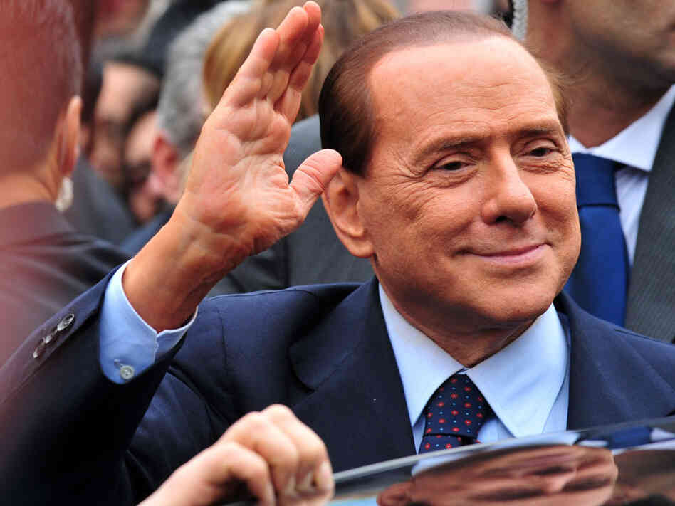 Italian Prime Minister Silvio Berlusconi acknowledges his supporters at legal hearing over allegations of fiscal fraud and breach of trust in his business interests on March 28 at Milan's justice court. Italian Prime Minister Silvio Berlusconi acknowledges his supporters at legal hearing over allegations of fiscal fraud and breach of trust in his business interests on March 28 at Milan's justice court.