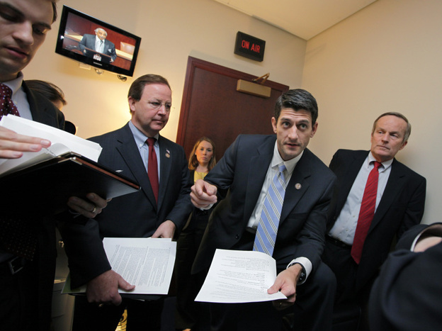 The CBO says House Budget Committee Chairman Paul Ryan's plan for Medicare could lead to health care rationing. Ryan is shown here with Republican members of his committee on Capitol Hill, April 5, 2011.
