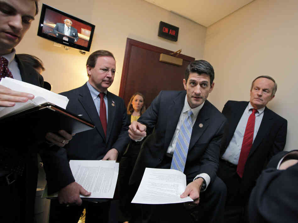 The CBO says House Budget Committee Chairman Paul Ryan's plan for Medicare could lead to health care rationing. Ryan is shown here with Republican members of his committee on Capitol Hill, April 5, 2011.
