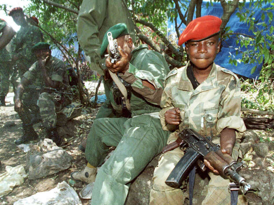 Two young members of the rebels opposing government forces of then-President Laurent Kabila are seen in Goma before going to the front, Aug. 22, 1998. Two young members of the rebels opposing government forces of then-President Laurent Kabila are seen in Goma before going to the front, Aug. 22, 1998.