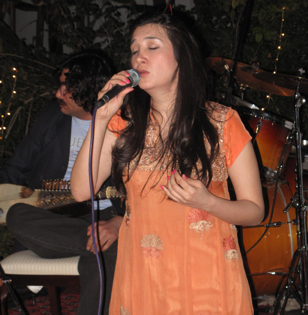 Zeb Bangash sings at a performance  coordinated by the U.S. Embassy. The two musicians are competing to tour the  United  States, part of a State Department cultural  exchange. The U.S. has spent  millions on public diplomacy in Pakistan.