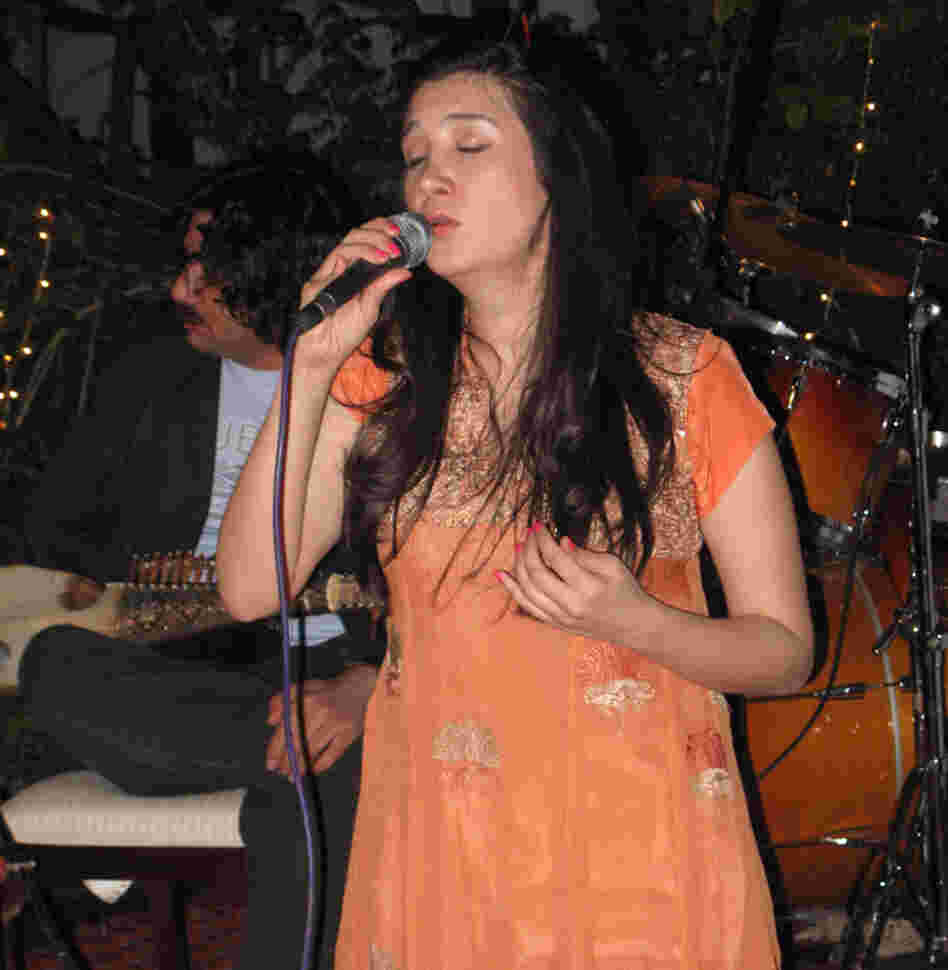Zeb Bangash sings at a performance  coordinated by the U.S. Embassy. The two musicians are competing to tour the  United  States, part of a State Department cultural  exchange. The U.S. has spent  millions on public diplomacy in Pakistan.