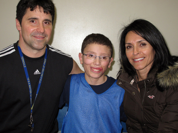 Jake Finkbonner, shown with his father, Donny, and mother, Elsa, nearly died after contracting a flesh-eating bacterium. His family and friends prayed for a miracle, and now the Vatican is investigating whether one actually occurred.