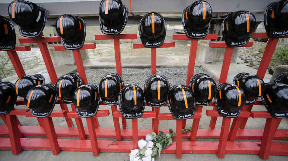 Mine helmets and painted crosses sit at the entrance to Massey Energy's Upper Big Branch coal mine April 5 in Montcoal, W.Va. The memorial represents the 29 coal miners who were killed in an explosion at the mine a year ago. Mine helmets and painted crosses sit at the entrance to Massey Energy's Upper Big Branch coal mine April 5 in Montcoal, W.Va. The memorial represents the 29 coal miners who were killed in an explosion at the mine a year ago.