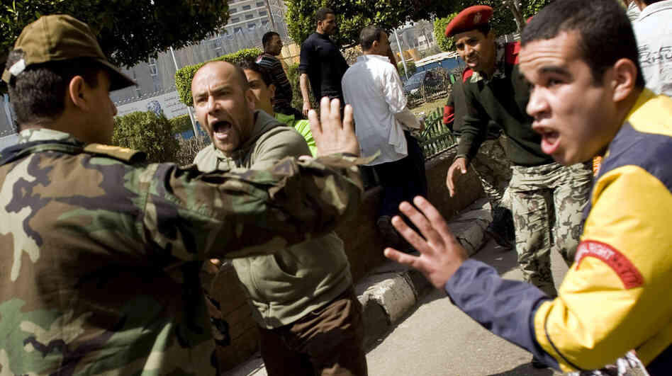 An Egyptian soldier argues with protesters during a rally in Cairo's Tahrir Square in March against proposed constitutional amendments. Many in Egypt now say that the military, once embraced by anti-government protesters who forced President Hosni Mubarak from office, is bypassing civilian laws and courts. An Egyptian soldier argues with protesters during a rally in Cairo's Tahrir Square in March against proposed constitutional amendments. Many in Egypt now say that the military, once embraced by anti-government protesters who forced President Hosni Mubarak from office, is bypassing civilian laws and courts.