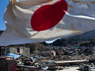 A Japanese flag waved Wednesday over the the wreckage and devastation in Onagawa, Miyagi prefecture. A Japanese flag waved Wednesday over the the wreckage and devastation in Onagawa, Miyagi prefecture.