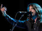 Dave Grohl on stage with the Foo Fighters at the Grammy Awards in 2008. "The first time I ever went to a big concert it freaked me out," Grohl says. "[I thought,] this is insane."