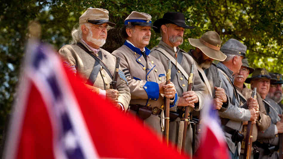 Magnolia Cemetery in Charleston, S.C., is the resting place of more than 2,000 Confederate soldiers. Above, Civil War re-enactors mark Confederate Memorial Day last year at the cemetery. As the 150th anniversary of the start of the war approaches, there are fears that the commemorations will rekindle old hatreds. Magnolia Cemetery in Charleston, S.C., is the resting place of more than 2,000 Confederate soldiers. Above, Civil War re-enactors mark Confederate Memorial Day last year at the cemetery. As the 150th anniversary of the start of the war approaches, there are fears that the commemorations will rekindle old hatreds.