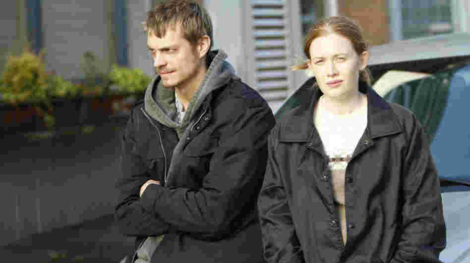 Detectives Stephen Holder (Joel Kinnaman) and Sarah Linden (Mireille Enos) are assigned to work together on AMC's latest drama series, The Killing.