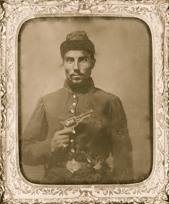 A black soldier poses with his revolver in 1865. 