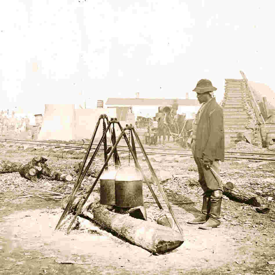 A Union Army cook prepares a meal in 1863. 