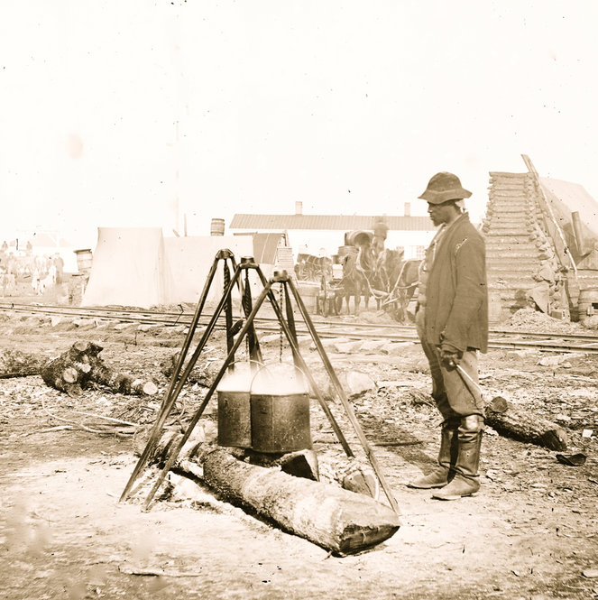 A Union Army cook prepares a meal in 1863. 