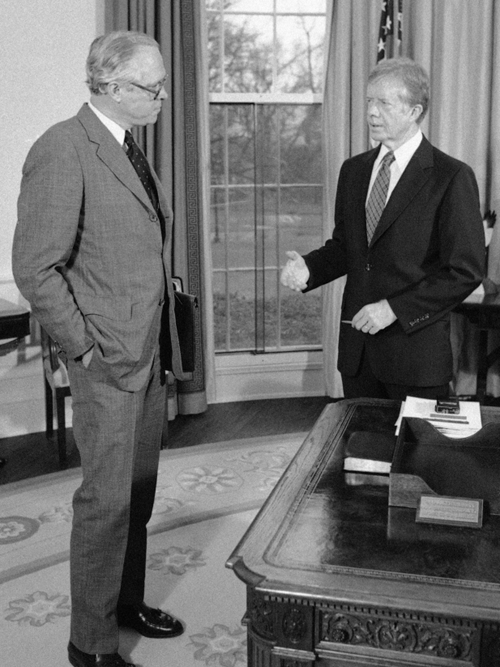 Benjamin Civiletti (left), Jimmy Carter's attorney general, wrote a legal opinion that argued that if Congress doesn't say yes to spending on time, it means no.