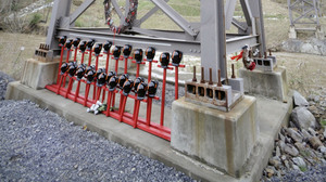 Mine helmets and painted crosses sit at the entrance to Massey Energy's Upper Big Branch coal mine Tuesday in Montcoal, W.Va. The memorial honors the 29 coal miners who were killed in an explosion at the mine April 5, 2010.