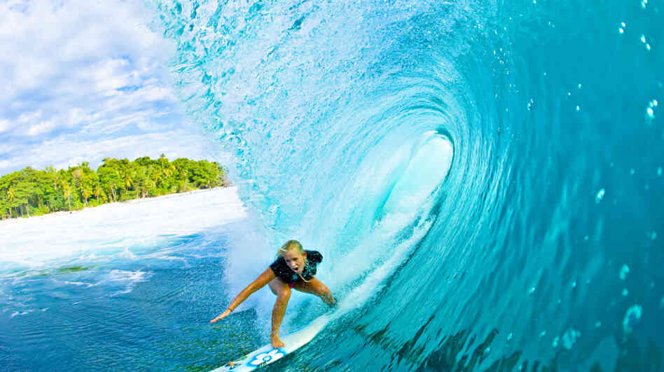 In 2003, 13-year-old surfing phenom Bethany Hamilton lost her left arm in a terrifying shark attack. Undeterred, Hamilton won her first national title in 2005, and went pro in 2007. She is pictured above in 2008, surfing in Mentawai, Indonesia. In 2003, 13-year-old surfing phenom Bethany Hamilton lost her left arm in a terrifying shark attack. Undeterred, Hamilton won her first national title in 2005, and went pro in 2007. She is pictured above in 2008, surfing in Mentawai, Indonesia.