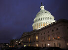 The U.S. Capitol building illuminated Friday evening, as Congress worked inside to reach a budget compromise and avert a government shutdown. The U.S. Capitol building illuminated Friday evening, as Congress worked inside to reach a budget compromise and avert a government shutdown.