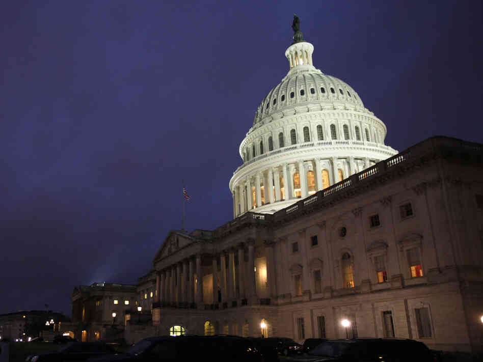 The U.S. Capitol building illuminated Friday evening, as Congress worked inside to reach a budget compromise and avert a government shutdown. The U.S. Capitol building illuminated Friday evening, as Congress worked inside to reach a budget compromise and avert a government shutdown.