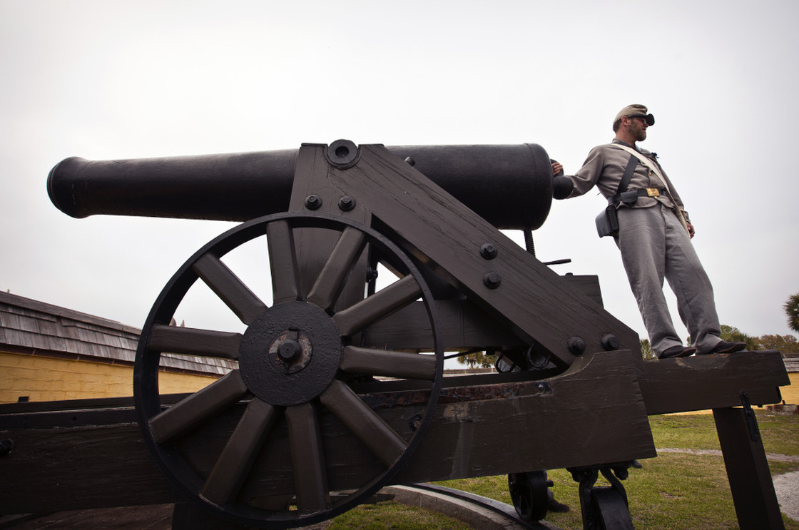 A Confederate re-enactor readies an authentic Civil War cannon Saturday at Fort Moultrie in South Carolina.