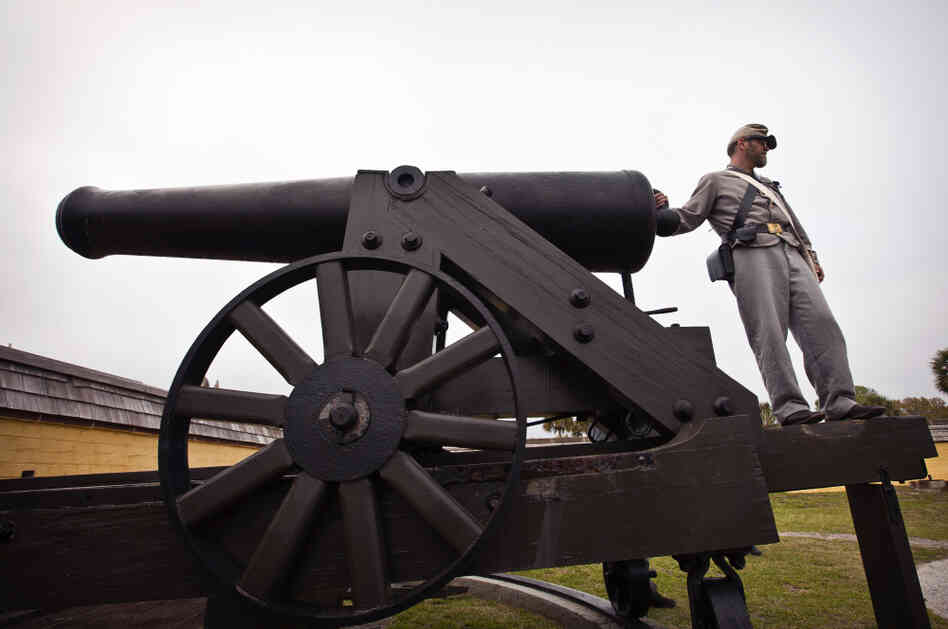A Confederate re-enactor readies an authentic Civil War cannon Saturday at Fort Moultrie in South Carolina.