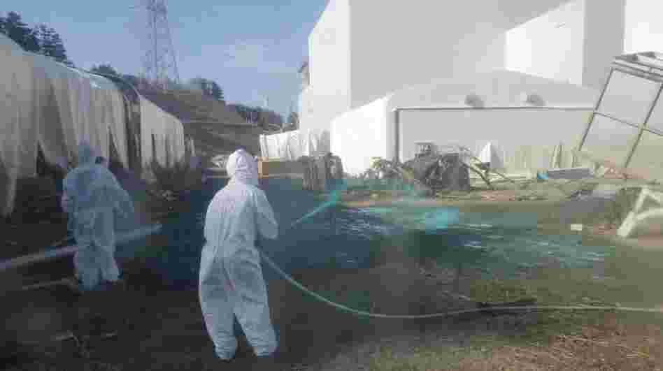 Workers at the Fukushima Dai-ichi nuclear power plant spray a substance to help reduce dust on April 1. The cleanup operation at the facility could take more than a decade. Workers at the Fukushima Dai-ichi nuclear power plant spray a substance to help reduce dust on April 1. The cleanup operation at the facility could take more than a decade.