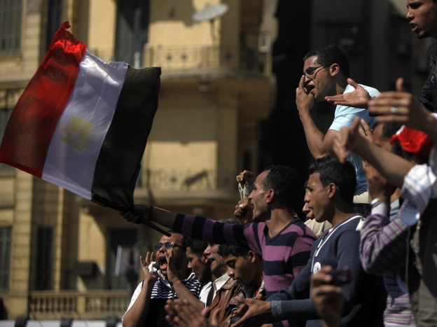 Many Egyptians have continued to gather in Cairo's Tahrir Square to demand reform. These men were there Sunday.