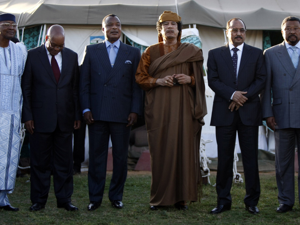 Libyan leader Moammar Gadhafi (third from right) stood with five delegates of the African Union after negotiations Sunday at his Bab al-Aziziya compound in Tripoli. From left: Presidents Amadou Toumani Toure of Mali, Jacob Zuma of South Africa, Denis Sassou Nguesso of Congo and Mohamed Ould Abdel Aziz of Mauritania, and African Union Commission Chairman Jean Ping.