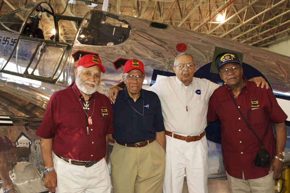 Leo Gray (from left), Thurston Gaines, John Lyle and William E. Rice stand in front of a P-51C Mustang. Gray organized the reunion, bringing together men who hadn't seen each other for more than 60 years. "The youngest one of us is, what, 85? 86?" he said. "So I wanted to do this before another one of us died." 