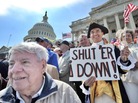 Protesters demonstrate in front of the Capitol in Washington, D.C., urging for a government shutdown and spending cuts. Protesters demonstrate in front of the Capitol in Washington, D.C., urging for a government shutdown and spending cuts.