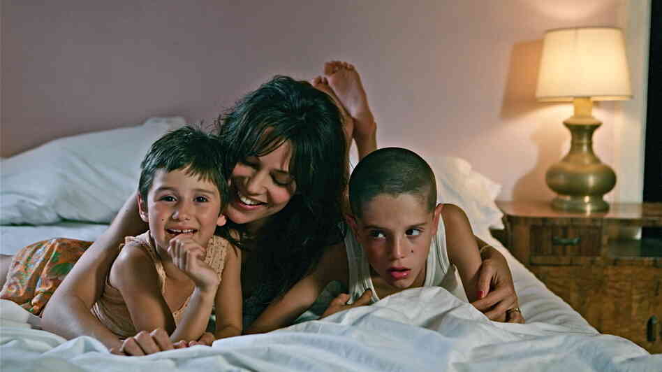 Life was 'Beautiful': A carefree mother (Micaela Ramazzotti, center), an angry father and the string of men who succeed him make for a chaotic childhood for Bruno (Giacomo Bibbiani, right) and his sister Valeria (Aurora Frasca). Life was 'Beautiful': A carefree mother (Micaela Ramazzotti, center), an angry father and the string of men who succeed him make for a chaotic childhood for Bruno (Giacomo Bibbiani, right) and his sister Valeria (Aurora Frasca).