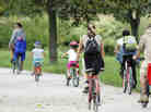 Family cycling on a path.