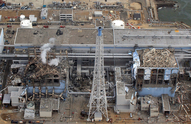 The Fukushima Dai-Ichi plant Reactor Numbers Three and Four on March 20, 2011. Smoke rises over Three.