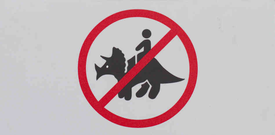 A warning sign to avoid the urge at the Royal Tyrrell Museum in Drumhiller, Alberta. A warning sign to avoid the urge at the Royal Tyrrell Museum in Drumhiller, Alberta.