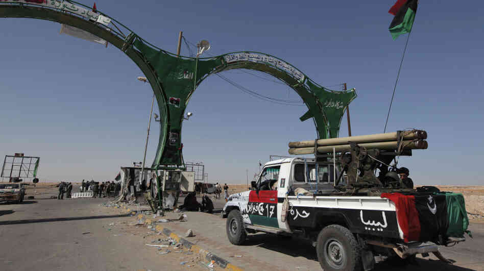 A rebel pickup truck armed with a rocket launcher sat guarding the western gate to the city of Ajdabiya in eastern Libya on Wednesday. A rebel pickup truck armed with a rocket launcher sat guarding the western gate to the city of Ajdabiya in eastern Libya on Wednesday.