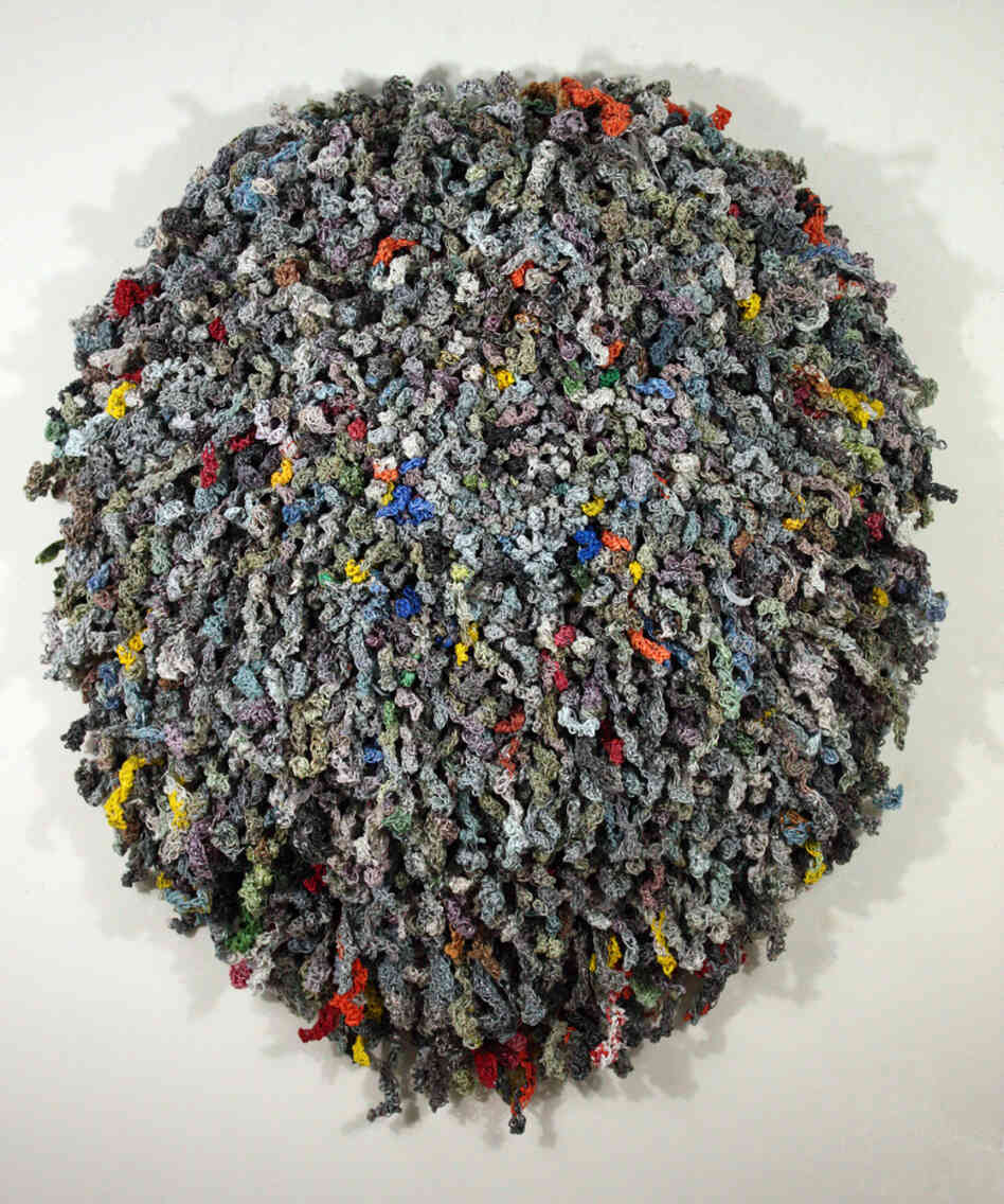 Jodi Collella asked her friends and family to save the little plastic bags used to deliver newspapers. She shredded them, spun them, and crocheted them into One Day.
