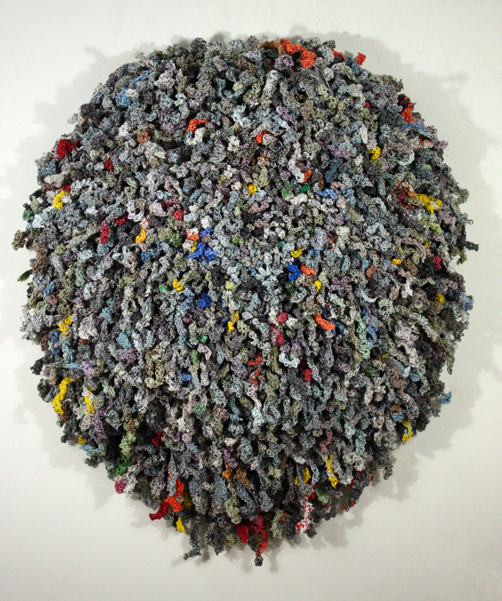 Jodi Collella asked her friends and family to save the little plastic bags used to deliver newspapers. She shredded them, spun them, and crocheted them into One Day.