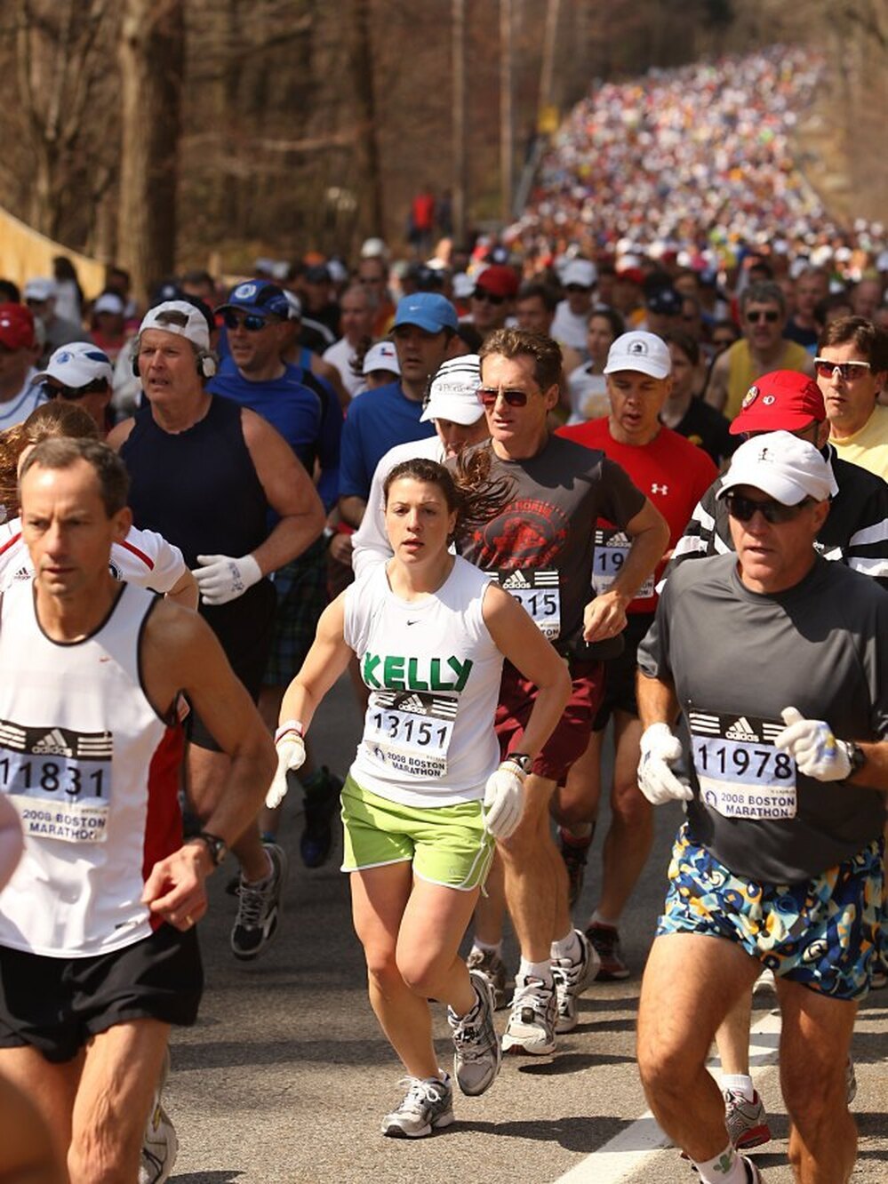 Runners compete in the 2008 Boston Marathon. Faced with a rising number of qualified entries, the race's organizers plan to adjust the rules to favor runners with the fastest times.