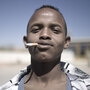 A man smokes outside a voter registration center in Burao, Somaliland. A man smokes outside a voter registration center in Burao, Somaliland.