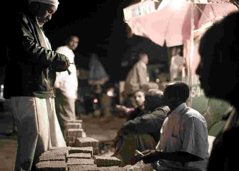 Men change money in central Hargeisa. Somaliland has its own currency — the Somaliland shilling. It takes stacks of shillings to equal one U.S. dollar, and piles of shillings are seen throughout the city, often transported by wheelbarrow. Theft in Somaliland is rare, and there are few reservations about having so much money out in the open.