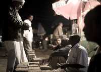 Men change money in central Hargeisa. Somaliland has its own currency — the Somaliland shilling. It takes stacks of shillings to equal one U.S. dollar, and piles of shillings are seen throughout the city, often transported by wheelbarrow. Theft in Somaliland is rare, and there are few reservations about having so much money out in the open.