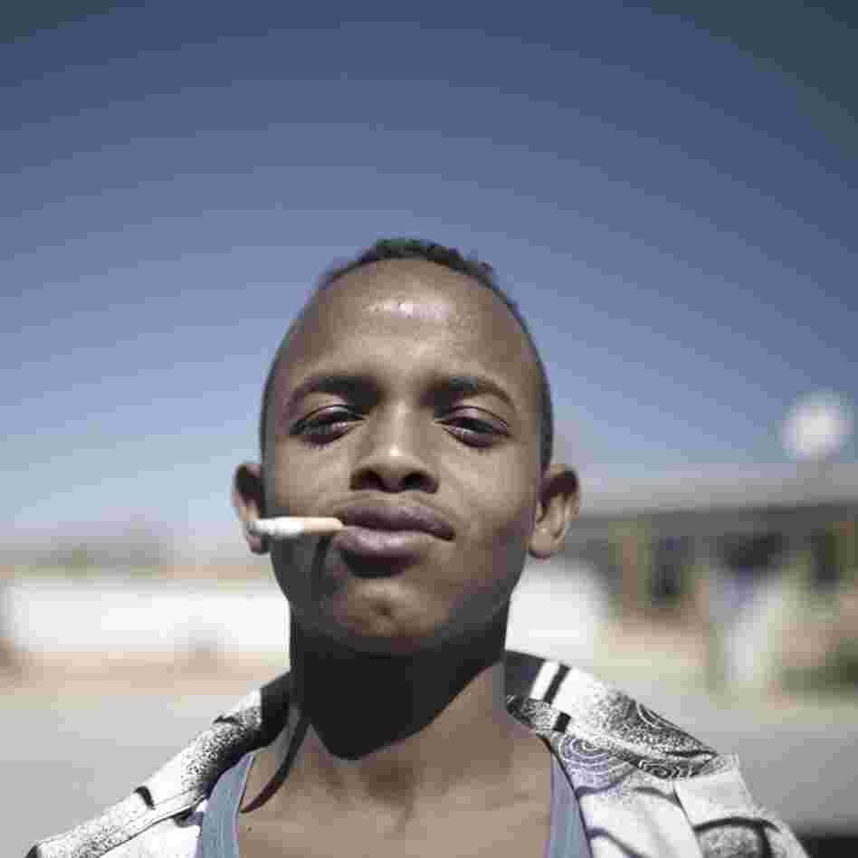 A man smokes outside a voter registration center in Burao, Somaliland.