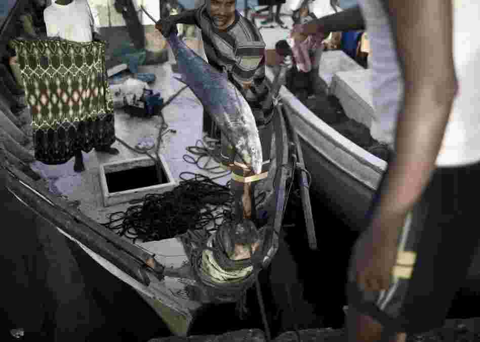 Fishermen unload their boat in the port city of Berbera after several days at sea.