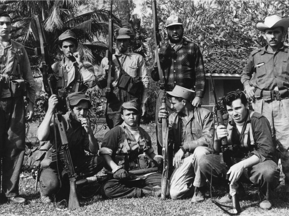 Members of Fidel Castro's militia gather in Cuba's Escambry Mountains during the ill-fated 1961 Bay of Pigs invasion.