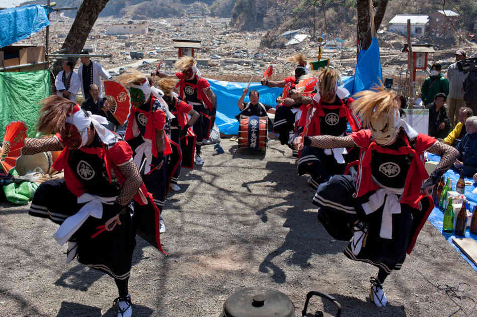 Japanese performers dance at a temple in the tsunami-devastated area of Rikuzentakata, Japan, on April 17. Japanese performers dance at a temple in the tsunami-devastated area of Rikuzentakata, Japan, on April 17.