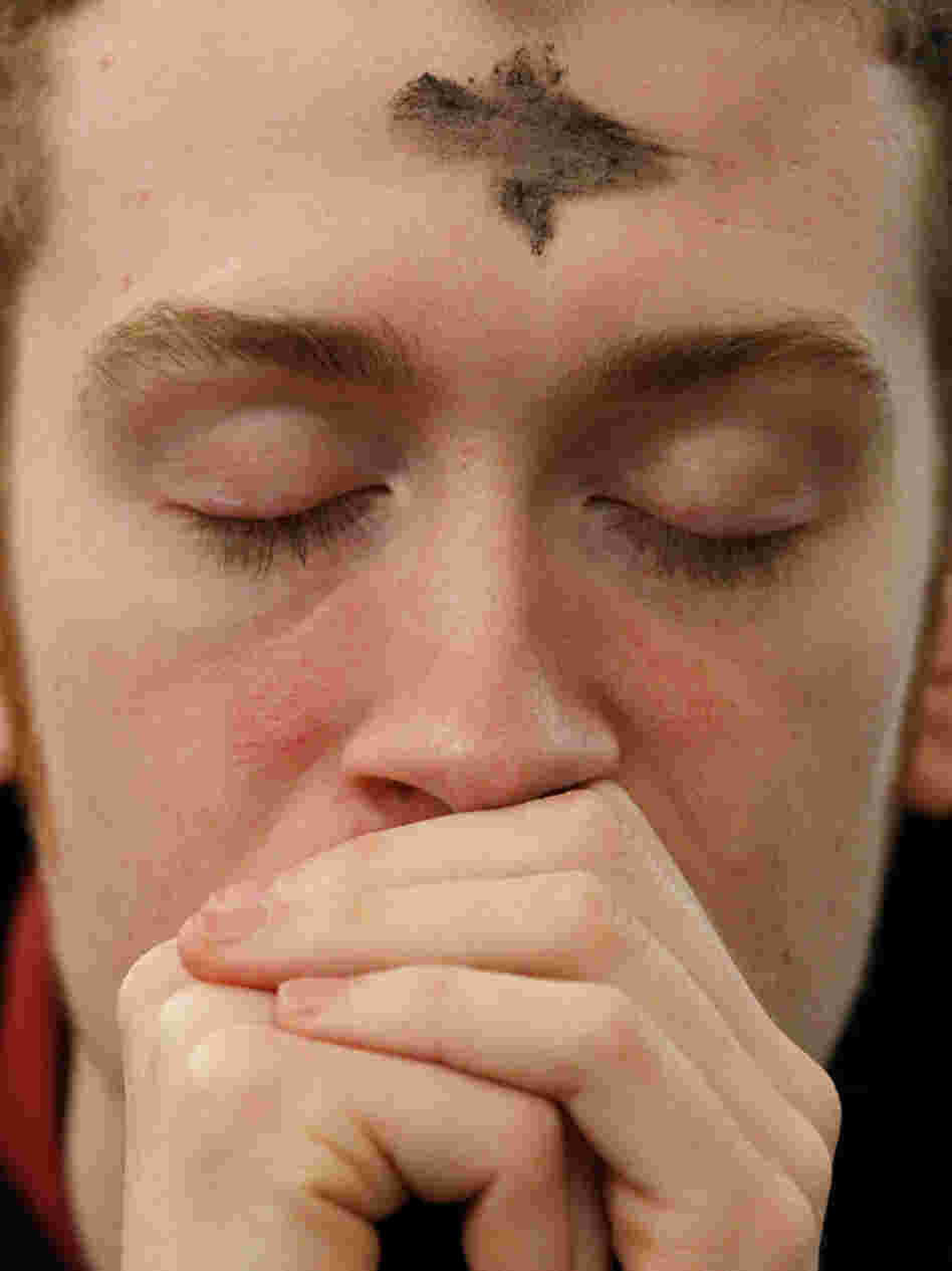 A man prays after receiving ashes during an Ash Wednesday Mass at Pro-Cathedral of Saint Patrick in Newark, N.J., March 9. A man prays after receiving ashes during an Ash Wednesday Mass at Pro-Cathedral of Saint Patrick in Newark, N.J., March 9.