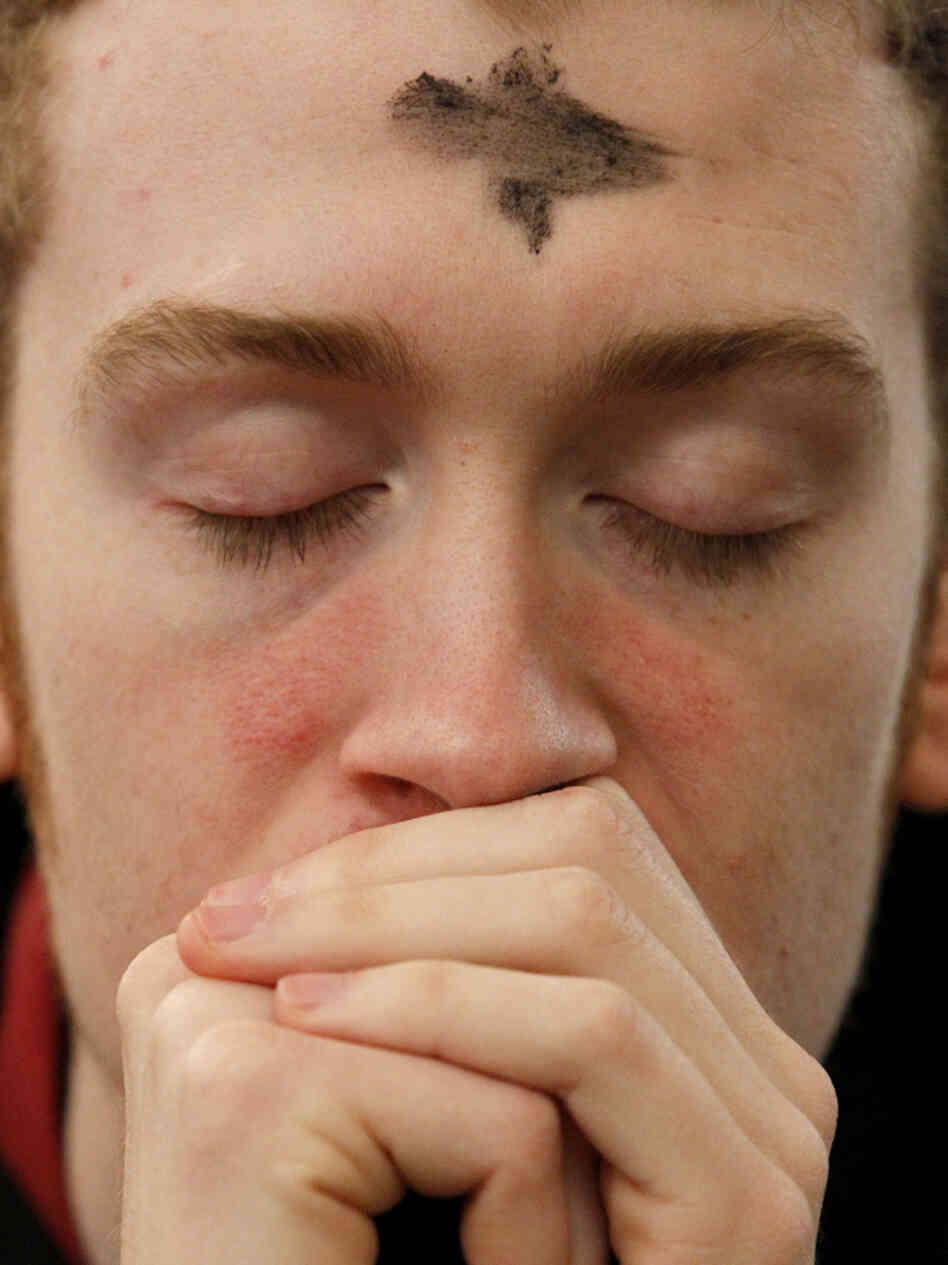 A man prays after receiving ashes during an Ash Wednesday Mass at Pro-Cathedral of Saint Patrick in Newark, N.J., March 9. A man prays after receiving ashes during an Ash Wednesday Mass at Pro-Cathedral of Saint Patrick in Newark, N.J., March 9.