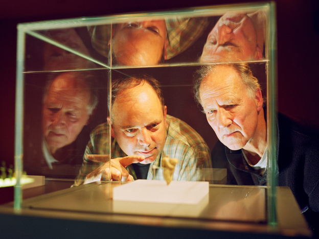 Anthropologist Nicholas Conard (left) and filmmaker Werner Herzog examine artifacts from the Chauvet caves in southern France.