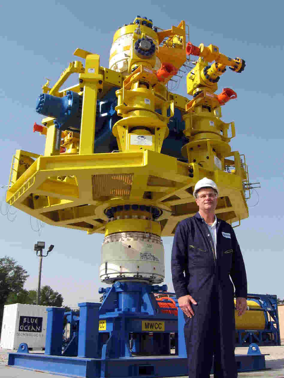 Dan Smallwood, chief operating officer for Marine Well Containment Co., stands in front of a capping stack that would be placed over an oil well to cap it off in an emergency.